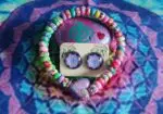 Conjunto pulsera y pendientes corazón morado